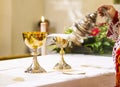 Cup with wine and ciborium with host on the altar of the holy mass Royalty Free Stock Photo