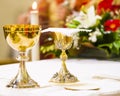 Cup with wine and ciborium with host on the altar of the holy mass Royalty Free Stock Photo