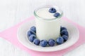 A cup of yogurt with blueberrys on the table Royalty Free Stock Photo