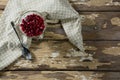 Cup of yogurt muesli and pomegranate with napkin and spoon