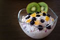 Cup of yogurt with orange and berries