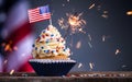 Cupcake and American Flag. Sparklers or fireworks lights burning in a cake. 4th of July, Independence, Presidents Day. Tasty cupca Royalty Free Stock Photo