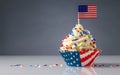 Cupcake. American Flag. US Holidays. Cake on 4th of July, Independence, Presidents Day. Tasty cupcakes with white cream icing and