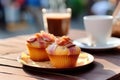 Cupcake with bacon and a cup of coffee on an open table in a cafe. Generative AI