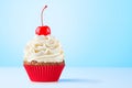 Cupcake. Birthday cupcake with cherry on top. Red cup liners. Happy Birthday. Tasty baking cupcakes, cake or muffin Royalty Free Stock Photo