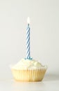 Cupcake with blue candle Royalty Free Stock Photo