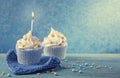 Cupcake with a blue candle Royalty Free Stock Photo