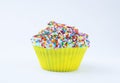 Cupcake with blue cream and colored sprinkles isolated on a white background. Copy space Royalty Free Stock Photo