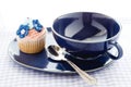 Cupcake and blue cup Royalty Free Stock Photo