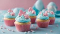 cupcake with blue frosting and sprinkles pastel blue and pink cupcakes with star baby-themed decorations