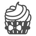 Cupcake with bow and cream frosting solid icon, pastry concept, creamy muffin icing vector sign on white background Royalty Free Stock Photo
