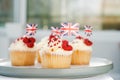 Cupcake with British Union jack flag and poppy flower. Remembrance Day. Selective focus, copy space.