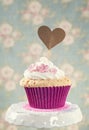 Cupcake with a cakepick Royalty Free Stock Photo