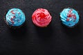 Cupcake cakes pink, blue on a dark background