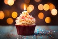 Cupcake with candle, birthday delight, bokeh lights backdrop, festive