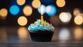 cupcake with candle A festive photo of a single birthday cupcake with a lit candle on top. The cupcake is chocolate Royalty Free Stock Photo