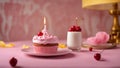 cupcake with candle A realistic scene of a birthday cake with a mini single candle on a plate. Royalty Free Stock Photo