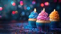 Cupcake Celebration with Bokeh Lights: Colorful Row of Candles and Sweets Royalty Free Stock Photo