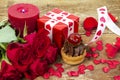 Cupcake with cherry in front of bouquet of red roses Royalty Free Stock Photo