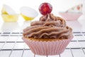 Cupcake with chocolate buttercream and cherry