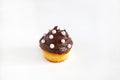 Cupcake with chocolate ganache and pink pearls, isolated