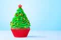 Cupcake. Christmas Tree cupcake with star on top. Red cup liners. Merry Christmas. Tasty baking cupcakes, cake or muffin