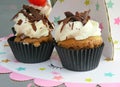 Cupcake close up with cream and chocolate sprinkles on top Royalty Free Stock Photo