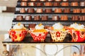 Cupcake with cream on top close-up and chocolates