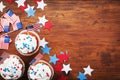 Cupcake decorated with american flag for happy Independence Day 4th july background. Holidays table top view. Royalty Free Stock Photo