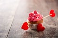 Cupcake decorated with sugar hearts for Valentine`s Day