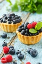 Cupcake with fresh blueberry and raspberry Royalty Free Stock Photo