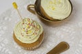 Cupcake with frosting and sprinkles, in golden cup Royalty Free Stock Photo
