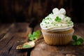 Cupcake with green cream and clover for St. Patrick Day.