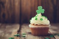 Cupcake with green cream and clover for St. Patrick Day.