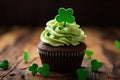 Cupcake with green cream and clover for St. Patrick Day.