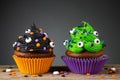 Cupcake on Halloween. Dessert on Halloween party. Chocolate muffin decorated with colored sprinkles Royalty Free Stock Photo