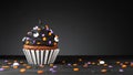 Cupcake on Halloween. Dessert on Halloween party. Muffin decorated with colored sprinkles, black frosting, icing Royalty Free Stock Photo