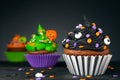 Cupcake on Halloween. Pumpkin Jack o lantern. Dessert on Halloween party. Muffin decorated with colored sprinkles Royalty Free Stock Photo