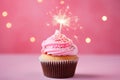 Cupcake With Lit Sparkler On Pink Background. Generative AI