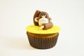 Cupcake with a monkey figure made of fondant Royalty Free Stock Photo