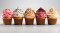 Cupcake muffin with icing frosting on solid background.