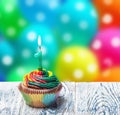 Cupcake with number one on the background of balloons Royalty Free Stock Photo