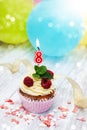 Cupcake with a numeral eigth candle