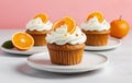 Fresh Orange Cupcakes with Cream Frosting and Citrus Slices Royalty Free Stock Photo