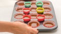 Cupcake pan lined with paper liners, and silicon molds filled with chocolate cake batter Royalty Free Stock Photo