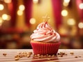 a cupcake with pink frosting and a gold star topper Royalty Free Stock Photo