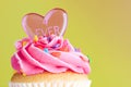 Cupcake with pink frosting and heart Royalty Free Stock Photo