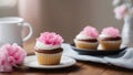 cupcake with pink frosting a romantic cupcake with white frosting and pink flowers on a plate