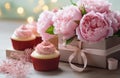 a cupcake is placed beside a gift box Royalty Free Stock Photo
