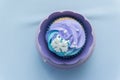 Cupcake purple and green decorated with a white snow flake